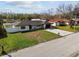 Modern home exterior with a new roof and landscaping at 26728 Hickory Loop, Lutz, FL 33559