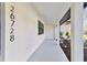 Modern front entry with tile walkway at 26728 Hickory Loop, Lutz, FL 33559