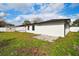 Back of house with new paint and landscaping at 26728 Hickory Loop, Lutz, FL 33559