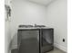 Laundry room with modern washer and dryer at 26728 Hickory Loop, Lutz, FL 33559