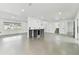 Spacious living area with an open floor plan and a kitchen island at 26728 Hickory Loop, Lutz, FL 33559