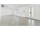 Bright and airy living room with tile floors and access to the backyard at 26728 Hickory Loop, Lutz, FL 33559