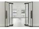 Modern office space with glass doors and gray tile floors at 26728 Hickory Loop, Lutz, FL 33559