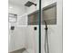 Modern shower with a frameless glass enclosure and stylish fixtures at 26728 Hickory Loop, Lutz, FL 33559