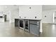 Modern wet bar with wine and beverage coolers at 26728 Hickory Loop, Lutz, FL 33559