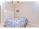 Bedroom features a ceiling fan, closet and neutral decor at 3406 Ranchdale Dr, Plant City, FL 33566