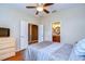 Comfortable bedroom with ceiling fan and attached bathroom at 3406 Ranchdale Dr, Plant City, FL 33566