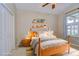 Charming bedroom featuring a wood frame bed, comfortable bedding, and stylish decor creating a cozy and inviting atmosphere at 3406 Ranchdale Dr, Plant City, FL 33566