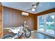 Bonus room with exterior access, drop ceiling, ceiling fan, and mini-split AC unit at 3406 Ranchdale Dr, Plant City, FL 33566