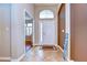 Inviting foyer with tile flooring and a large decorative window over the front door bringing in lots of light at 3406 Ranchdale Dr, Plant City, FL 33566