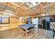 Finished garage space featuring wood plank walls and ceiling, storage, and workspace at 3406 Ranchdale Dr, Plant City, FL 33566
