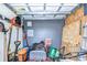 Garage space featuring lawn equipment and storage at 3406 Ranchdale Dr, Plant City, FL 33566