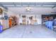 Spacious garage with ample storage, organized tools, and high ceilings, ideal for projects and parking at 3406 Ranchdale Dr, Plant City, FL 33566