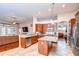 Spacious kitchen featuring granite countertops, stainless steel appliances, and center island at 3406 Ranchdale Dr, Plant City, FL 33566