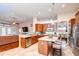 Well-appointed kitchen with granite countertops, stainless steel appliances, and a center island with bar seating at 3406 Ranchdale Dr, Plant City, FL 33566