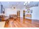 Spacious living room featuring hardwood floors, high ceilings, and a chandelier at 3406 Ranchdale Dr, Plant City, FL 33566