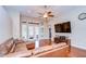 Large living room featuring hardwood floors, a ceiling fan, and French doors leading to the outside at 3406 Ranchdale Dr, Plant City, FL 33566