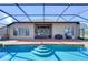 Backyard pool and patio area with built-in grill and outdoor furniture at 3406 Ranchdale Dr, Plant City, FL 33566