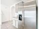 Stainless steel refrigerator in a kitchen with granite countertops at 34314 Jasper Stone Dr, Wesley Chapel, FL 33543