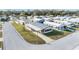 Aerial view of the community featuring manicured lawns and a welcoming street at 35934 Verano Ln, Zephyrhills, FL 33541