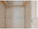 Empty closet featuring shelving and a hanging rack, ready for storage and organization at 35934 Verano Ln, Zephyrhills, FL 33541