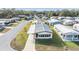 Charming single-story home featuring a metal roof and well-maintained front yard at 35934 Verano Ln, Zephyrhills, FL 33541