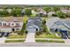 This home has an attached garage, a well-manicured lawn and mature landscaping at 4735 Rolling Green Dr, Wesley Chapel, FL 33543