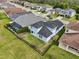 This home features a fenced-in yard and mature landscaping in a desirable neighborhood at 4735 Rolling Green Dr, Wesley Chapel, FL 33543