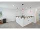 Well-lit bar area with dark granite countertop, pendant lights, and carpeted floors at 4735 Rolling Green Dr, Wesley Chapel, FL 33543