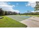 Outdoor basketball court with well-maintained court and basketball hoops in a green space at 4735 Rolling Green Dr, Wesley Chapel, FL 33543