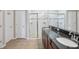 Updated bathroom includes double sinks, granite countertops, and a glass-enclosed shower at 4735 Rolling Green Dr, Wesley Chapel, FL 33543