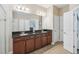 Spacious bathroom featuring double sinks, granite counters, and plenty of storage at 4735 Rolling Green Dr, Wesley Chapel, FL 33543
