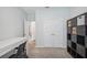 Bedroom features a desk and storage with carpeted floors and double door closet at 4735 Rolling Green Dr, Wesley Chapel, FL 33543