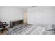 Bright bedroom featuring gray bed, natural light, desk and double door closet at 4735 Rolling Green Dr, Wesley Chapel, FL 33543