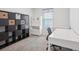 Bright bedroom with a window with modern decor and neutral carpeting at 4735 Rolling Green Dr, Wesley Chapel, FL 33543