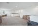 Large, open bonus room with neutral walls and carpet ready for your personalized design at 4735 Rolling Green Dr, Wesley Chapel, FL 33543