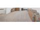Expansive bonus room with plush carpeting, ready for customization, partially filled with storage boxes at 4735 Rolling Green Dr, Wesley Chapel, FL 33543