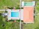 Aerial view of the community pool, clubhouse, and shuffleboard area at 4910 Bay Ne St # 103, St Petersburg, FL 33703