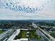 Aerial view of community buildings with a community pool and the city skyline in the distance at 4910 Bay Ne St # 103, St Petersburg, FL 33703