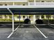 Assigned covered parking spot with lush landscaping at 4910 Bay Ne St # 103, St Petersburg, FL 33703