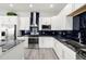 Modern kitchen with white cabinets, granite counters, and stainless steel appliances at 6132 105Th Ter, Pinellas Park, FL 33782