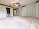Spacious bedroom with ample closet space and ceiling fan at 8040 Pasadena Dr, Port Richey, FL 34668