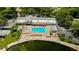 Community pool with sundeck and lake view at 8040 Pasadena Dr, Port Richey, FL 34668