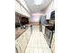 Kitchen with stainless steel appliances and light cabinets at 8040 Pasadena Dr, Port Richey, FL 34668