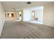 Spacious living room with carpet and sliding glass doors at 8040 Pasadena Dr, Port Richey, FL 34668
