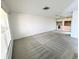 Spacious living room with carpet and sliding glass doors at 8040 Pasadena Dr, Port Richey, FL 34668