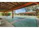 Community shuffleboard courts under covered area at 8040 Pasadena Dr, Port Richey, FL 34668