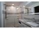 Updated bathroom with walk-in shower and granite vanity at 9042 Moonlit Meadows Loop, Riverview, FL 33578