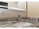 Bathroom with granite vanity and modern faucet at 9042 Moonlit Meadows Loop, Riverview, FL 33578