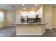 Kitchen with granite island, stainless steel appliances, and light-colored cabinets at 9042 Moonlit Meadows Loop, Riverview, FL 33578